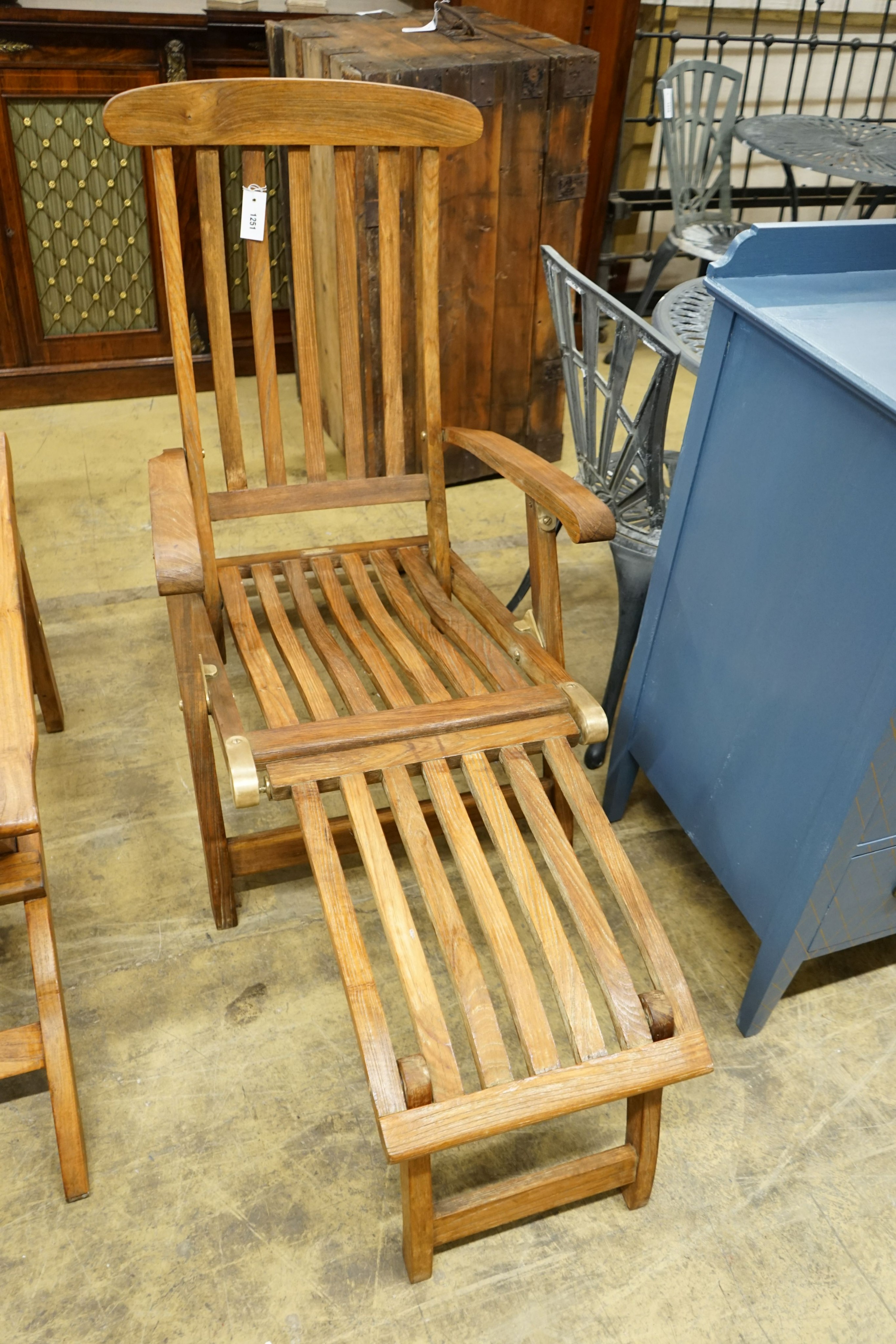 A teak brass mounted garden steamer chair, labelled Barlow Tyrie